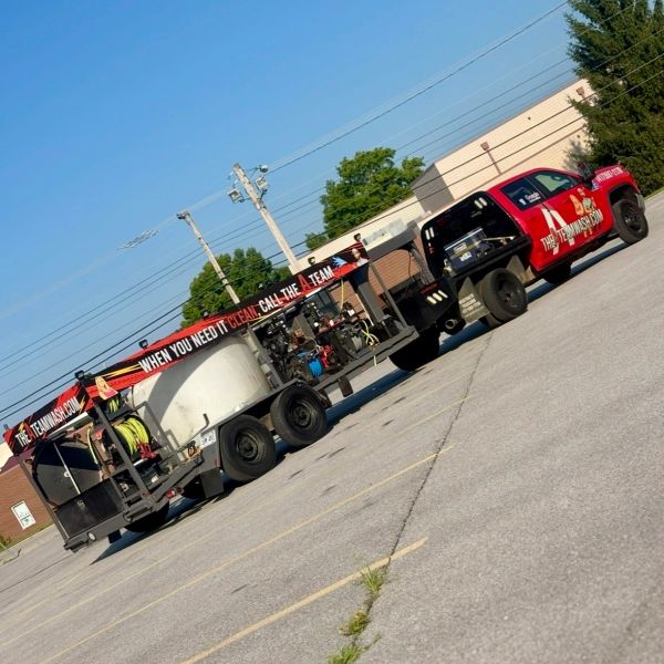 The A Team Pressure Washing commercial mobile washing trailer with onboard water tanks in Springfiel