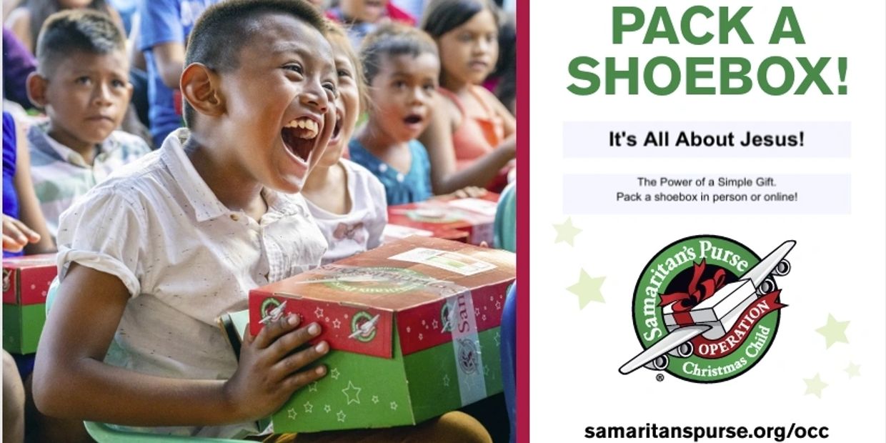 Excited children receiving Christmas shoebox gifts.