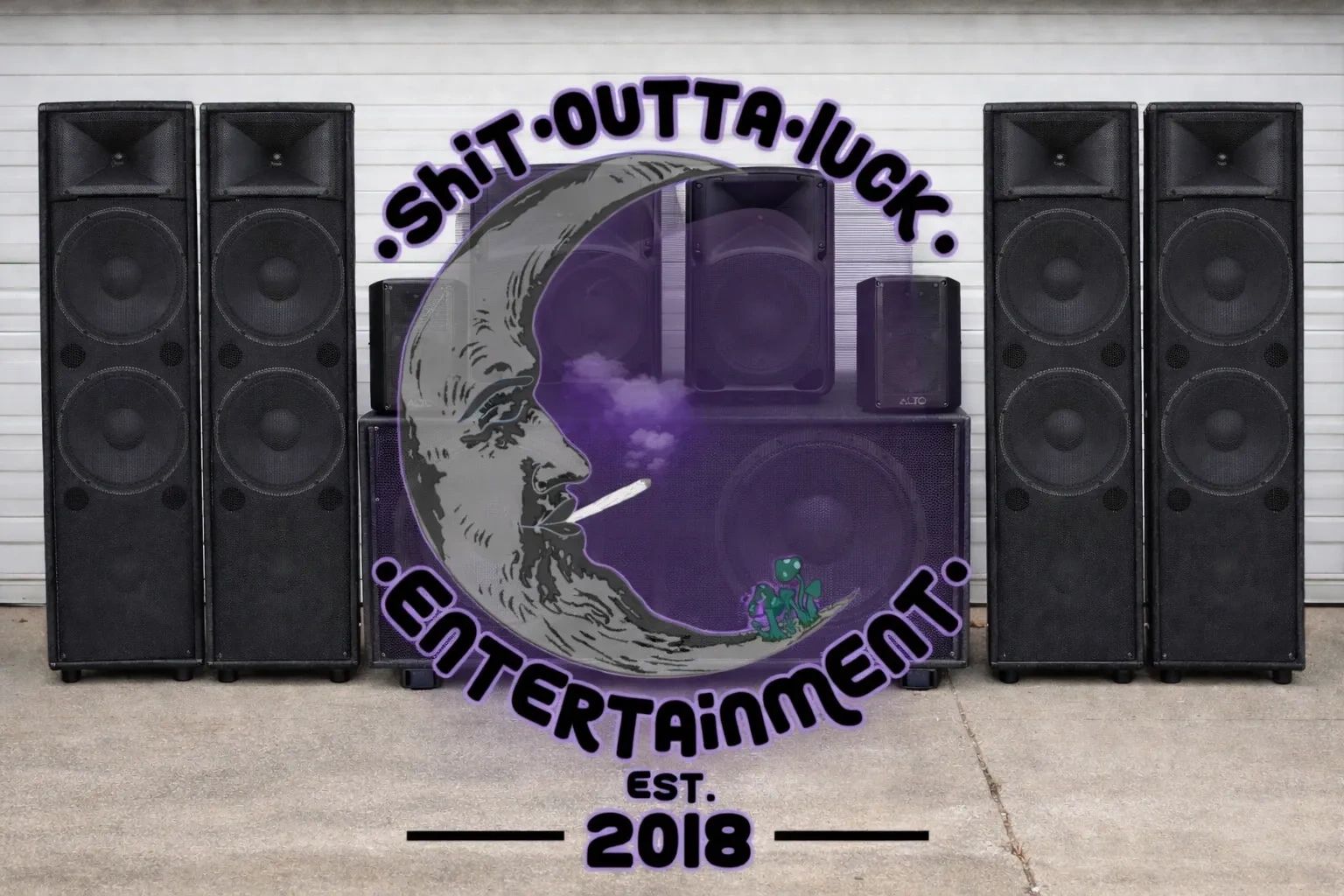 Logo of Shit Outta Luck Entertainment with speakers in the background.