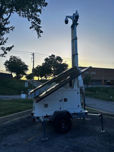 Utility truck with an elevated platform at dusk.