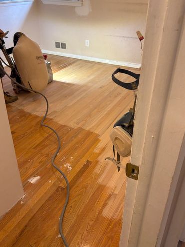 Hardwood flooring refinishing in progress…