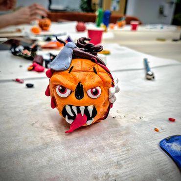 Team building office party making clay pumpkins for halloween in Newcastle upon Tyne