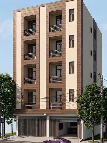 Modern multi-story residential building with balconies and large windows.