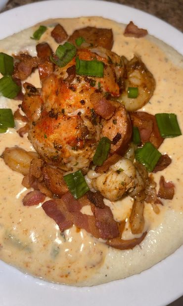 Creole shrimp n grits topped with lobster tail at LemmeFeedYouSUmn in Manteca