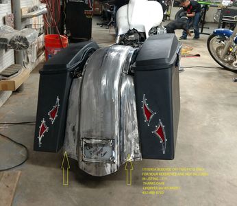 Custom rear fender and saddlebags with custom l.e.d. lights on the rear fender,frenched in license plate,also has stretched dash and stretched tanks covers on a 2014' Harley Davidson street glide