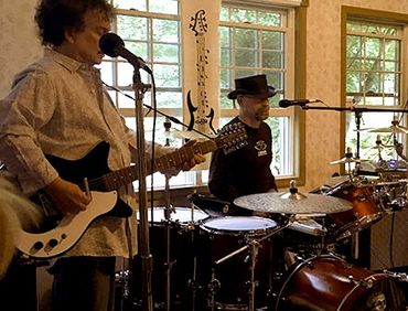 Musician live performance Barry Guy Preston on guitar and Paul Gabage on drums
