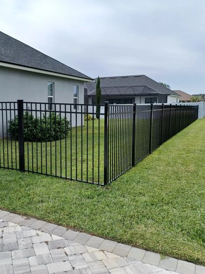 Black 3-channel Emily aluminum fence.