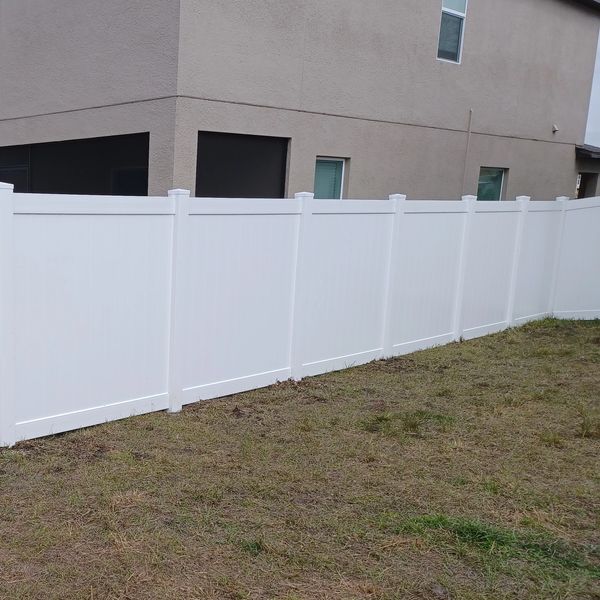 6' white vinyl fence.