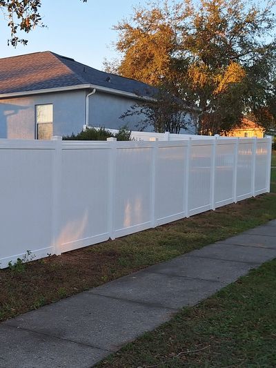 6' white vinyl fence.