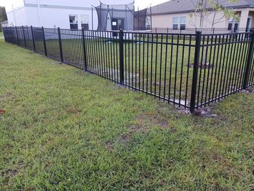 Black 3-channel Emily aluminum fence.