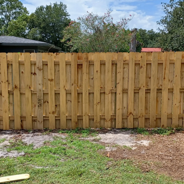 California or shadow-box style wood fence.