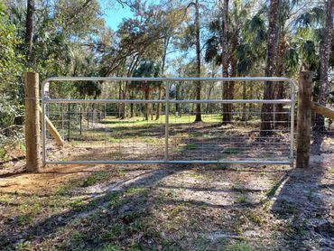 Wire-filled ranch gate with wooden dead man bracing.