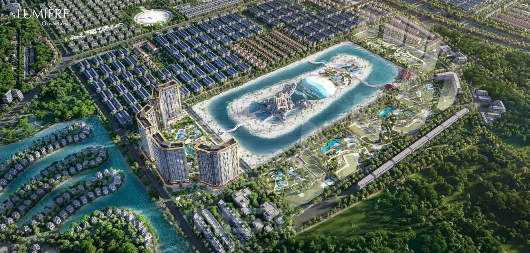 Aerial view of a modern residential complex with a central water feature.