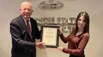 Marie Sarantakis receives Illinois State Bar Association Award from David Sosin.