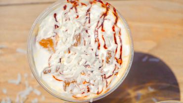 Dessert with cream and syrup.