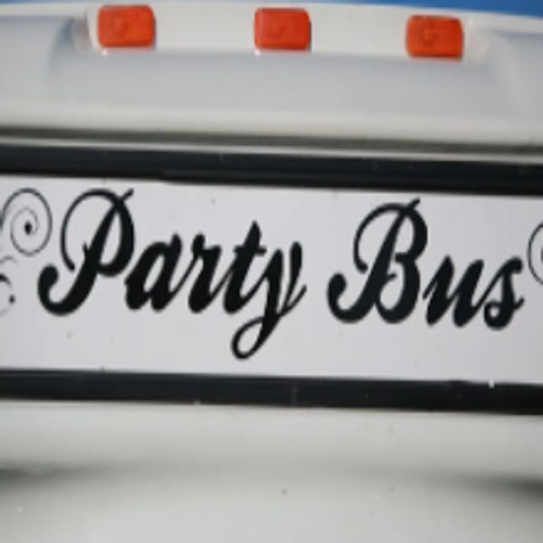Close-up of a sign reading 'Party Bus' in elegant script.