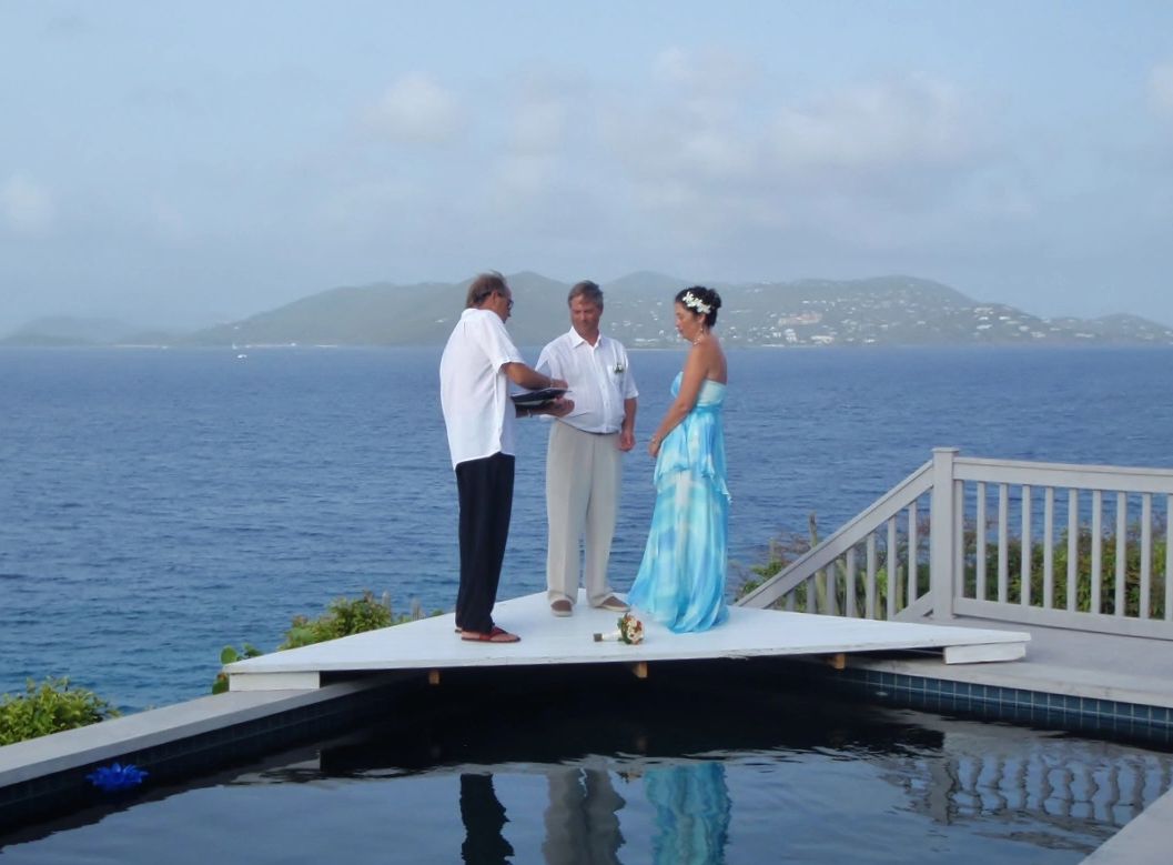 Wedding ceremony over pool - St John in the background.  Private Villa