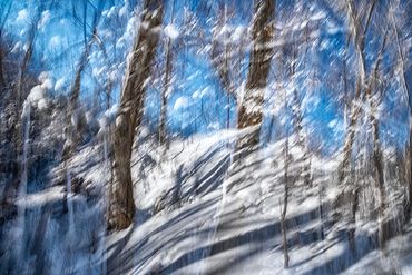 Exploring a snowy trail utilizing slow shutter, double exposure and intentional camera motion.