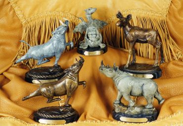 bronze moose, bronze wart hog, bronze rhino, bronze dragon