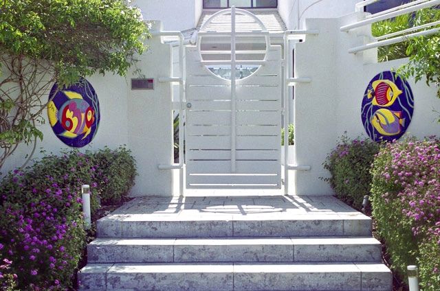 "Tropical Fish"
Free Form abstract High Relief ceramic  tiles mounted on entrance wall.