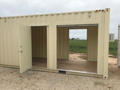 20' Container with a man door and roll-up door.