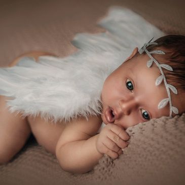Creative fine-art newborn photography.