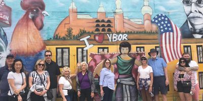 Private Ybor City Food Tour group standing in front I heart Ybor mural 7th Ave. Ybor City, Tampa FL