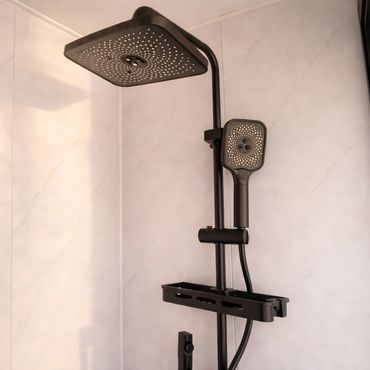 Modern black showerhead set with square design in a minimalist bathroom.