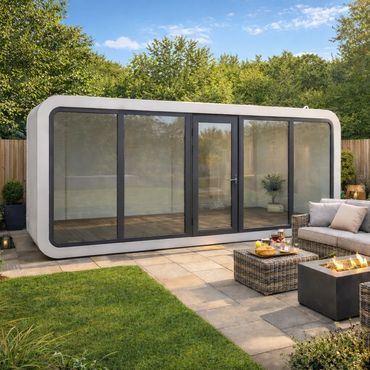 Modern garden pod with outdoor seating and fire pit on a sunny day.