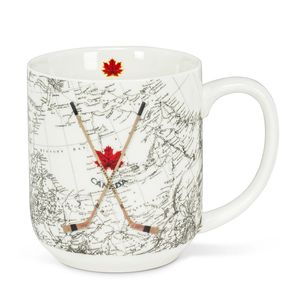 large coffee or hot beverage mug with crossed hockey sticks superimposed over a map of Canada