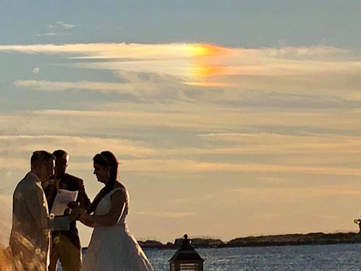 Bride and Groom under a sundog rainbow