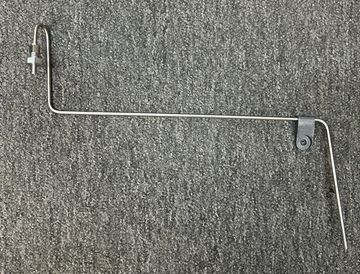 Metal wire tool with angled bends and a clamp on a gray surface.