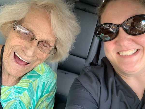 Caregiver & Client driving to a social outing.