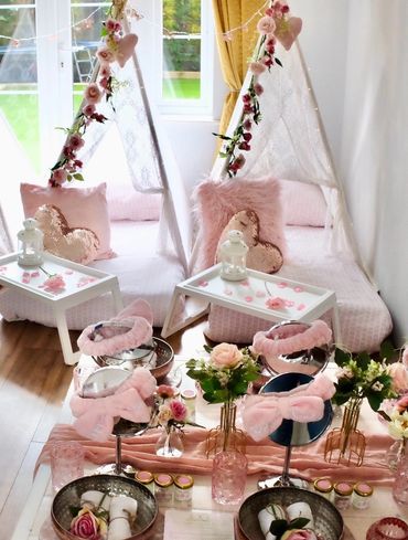 Pink sleepover setup with spa accessories.