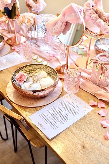 Pamper party with rose petals and bowls.