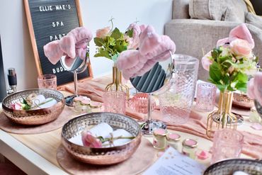 Pastel pamper table with name board sign.
