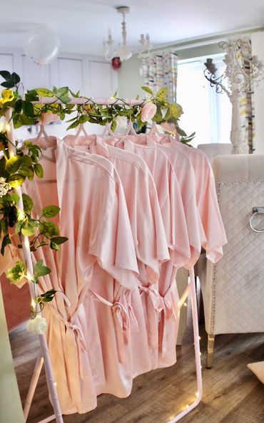 Pink robes ready for a pamper party.