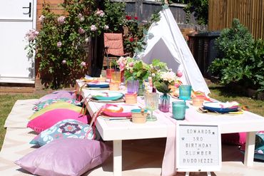 Colourful outdoor luxe picnic party in garden in Aston-on-Trent for little boys 3rd birthday party
