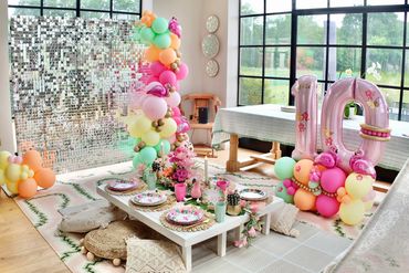 Tropical themed shimmer sequin wall and luxe picnic party with balloons in Staffordshire.