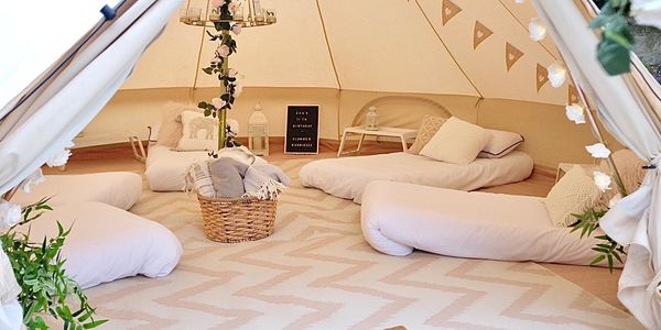 5m bell tent sleepover hire with neutral décor, ideal for garden parties in Derby & Nottingham.