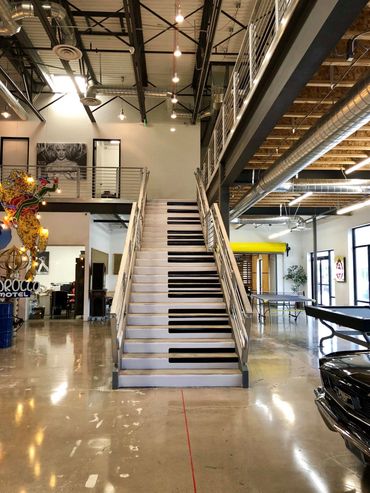 David Saxe Productions piano staircase and game room area.