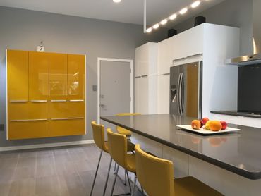 Modern kitchen remodel with yellow and white cabinets from IKEA in Austin TX