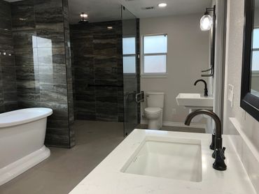 Bathroom remodel with his and hers sink separated and his is wheelchair friendly.