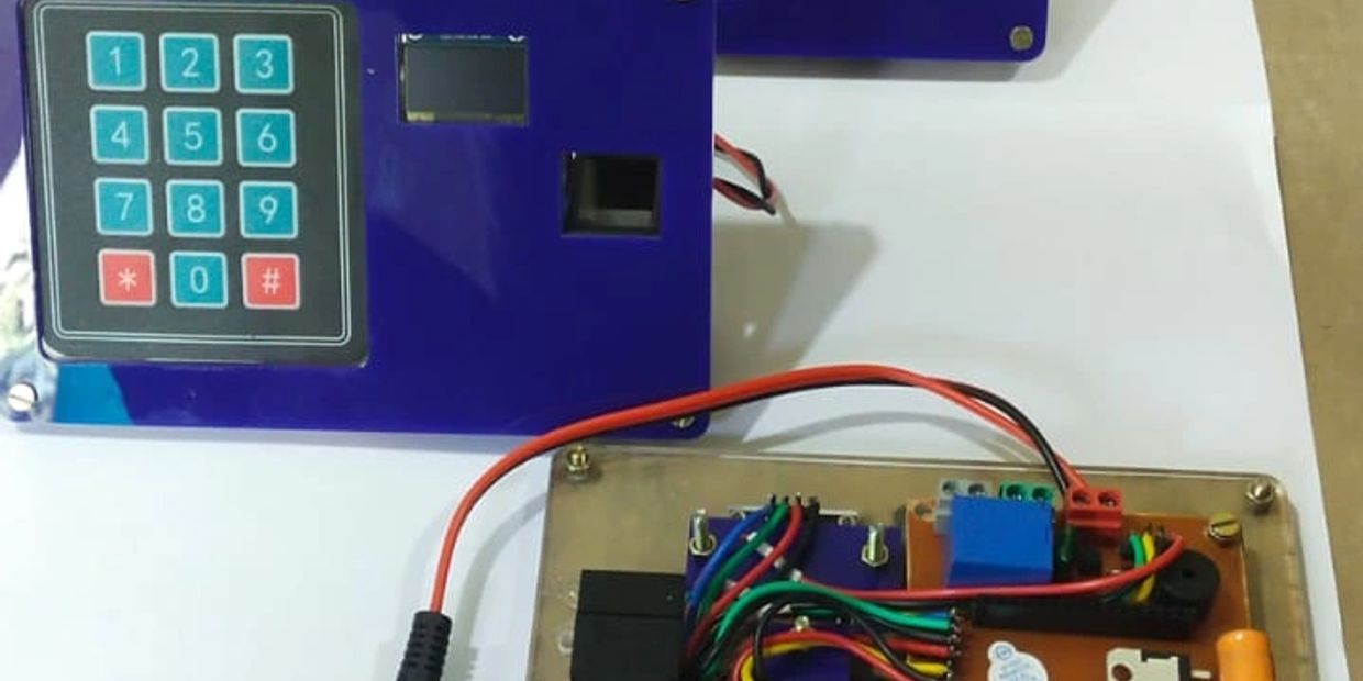 Electronic keypad and circuit board setup with colorful wiring.