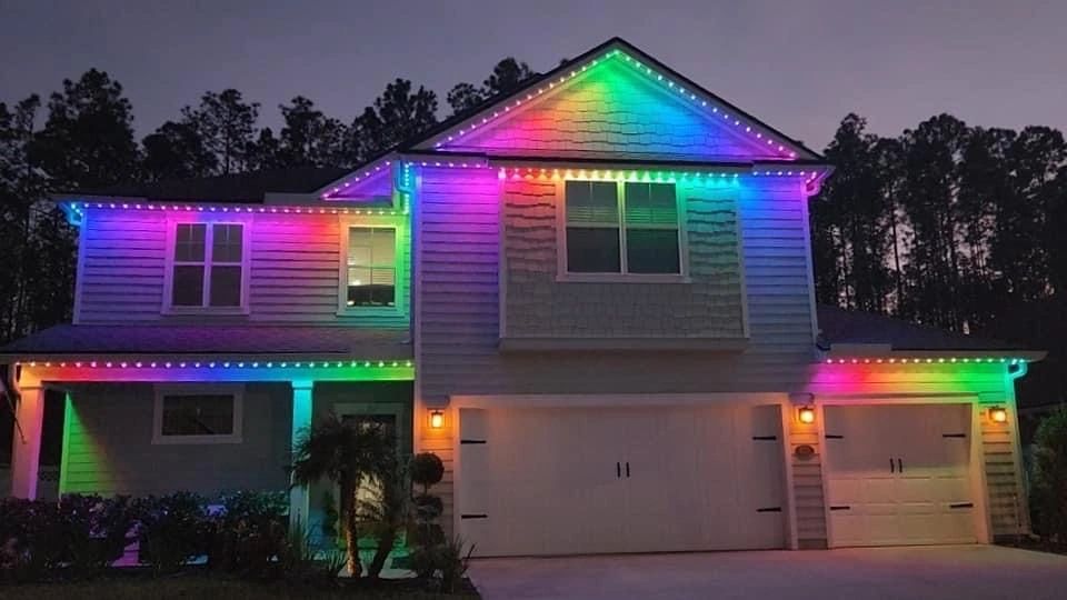 An image of a house with a rainbow pattern of led soffit lights in Saint Johns County, FL.