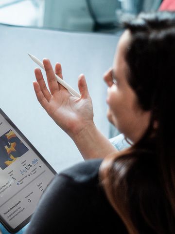 Graphic designer explaining social media analytics, instagram feed, facebook feed, design