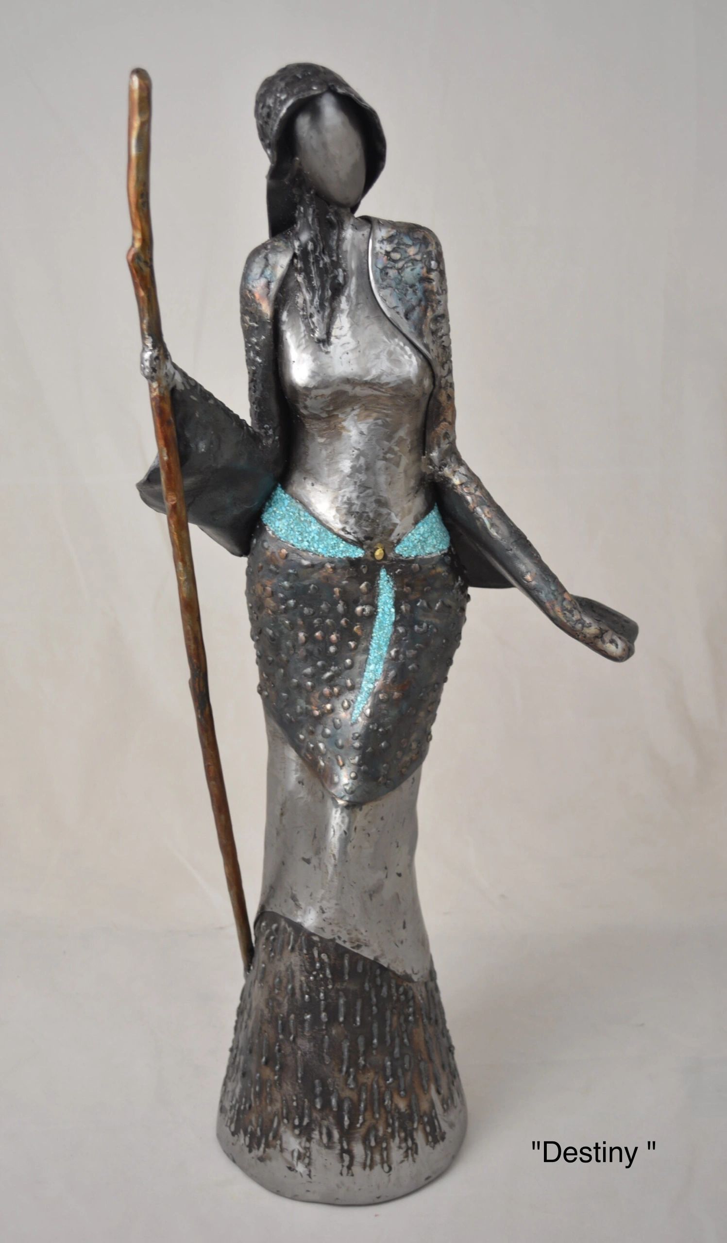 Woman with turquoise and walking stick