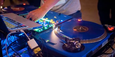 DJ Jon performing a live set on turntables, delivering professional DJ services in the Bay Area.