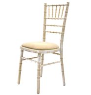 Chiavari lime-washed chair with natural pad.