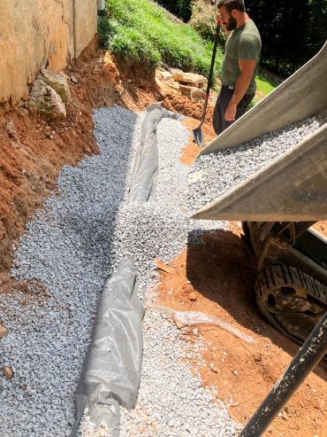 A French drain install in Center Point.